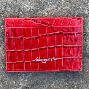 Red crocodile cardholder.